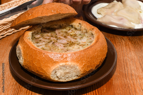 White Barszcz Zurek (Sour Bread Soup): Żur (Polish: żur, żurek) is a soup soured rye flour and meat photo