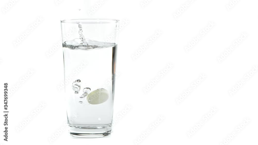 Super Slow Motion Shot of Falling Tablet into water Isolated on White Background at 1000fps. Super Slow Motion Shot of Falling Tablet into water Isolated on White Background at 1000fps.