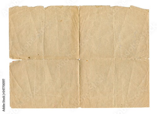 Vintage brown paper blank with torn edges isolated on white background. Old paper texture for design.