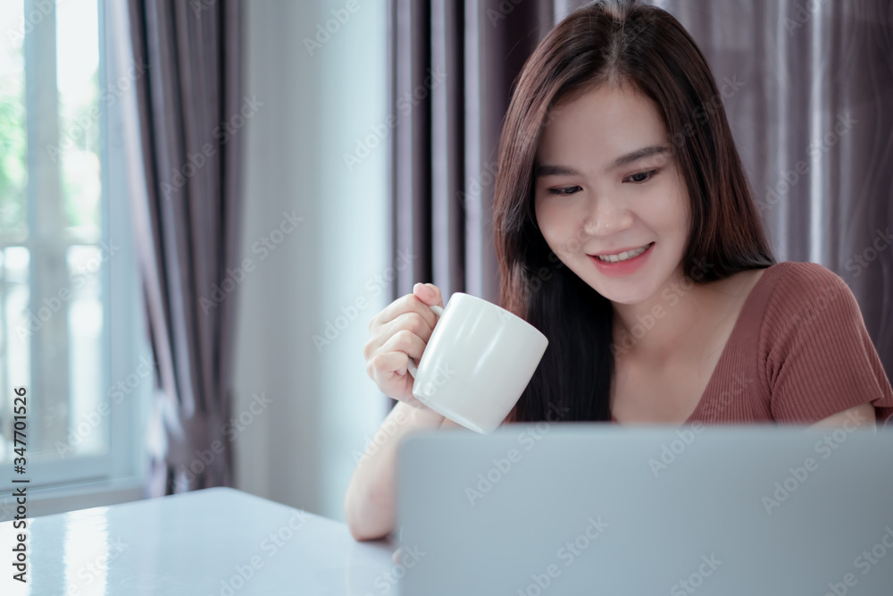Asian woman working from home with laptop computer self isolation from society to reduce risk, quarantine prevention coronavirus, covid-19 and study e-learing online education technology concept. Asian woman working from home with laptop computer self isolation from society to reduce risk, quarantine prevention coronavirus, covid-19 and study e-learing online education technology concept.