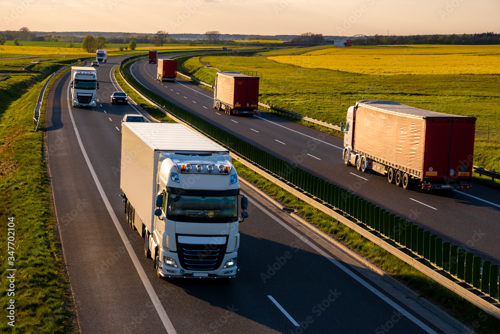 heavy truck traffic on the highway in the evening