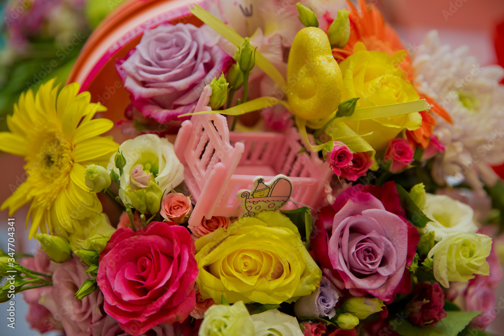 Pink Carriages bouquet . Colorfull flowers . Yellow and red flowers . Bouquet for the birth of a child .