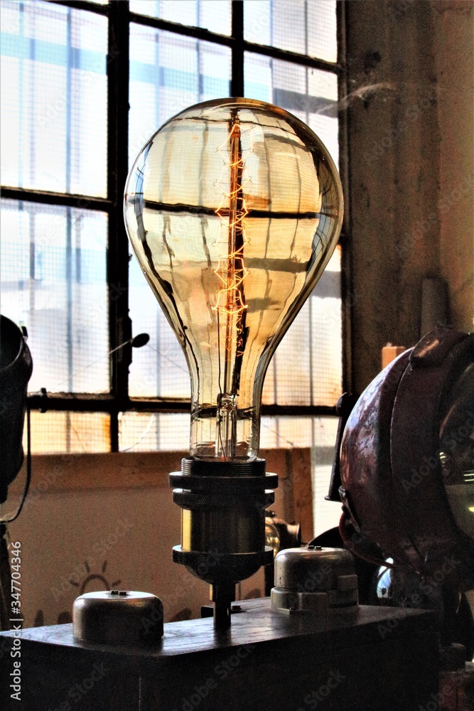 Milan, Italy, 2017.05.21 evocative image of large electric light bulb at a vintage market