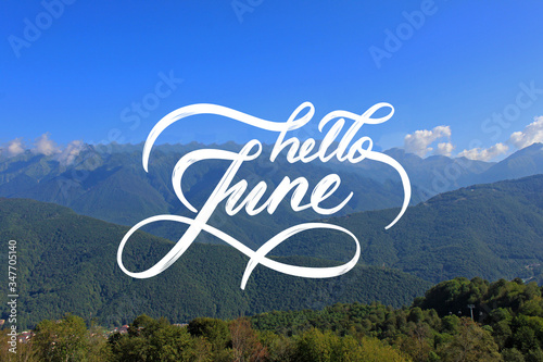 Hello June hand lettering card. Hand drawn script and summer mountain landscape on background. Seasons calendar months.