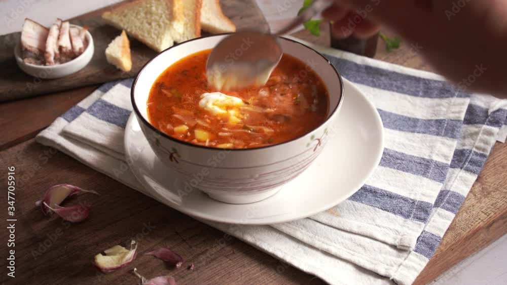 National Ukrainian and Russian borscht with lard and garlic, tomato and beetroot soup with sour cream National Ukrainian and Russian borscht with lard and garlic, tomato and beetroot soup with sour cream