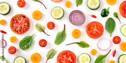 Fresh summer vegetables, a flat lay panorama on a white background, vibrant food pattern, shot from the top