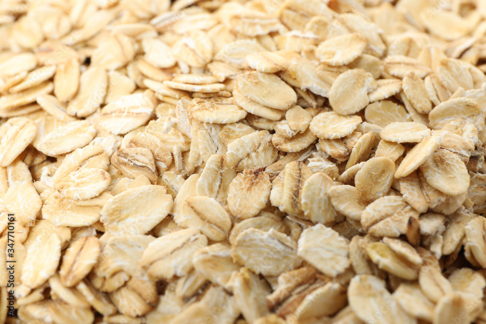 Oatmeal flakes texture on whole background, close up Oatmeal flakes texture on whole background, close up