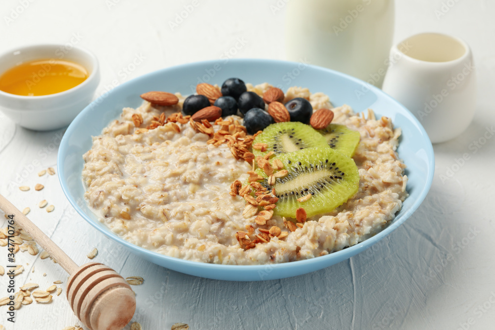 Composition with oatmeal with fruits on white background Composition with oatmeal with fruits on white background