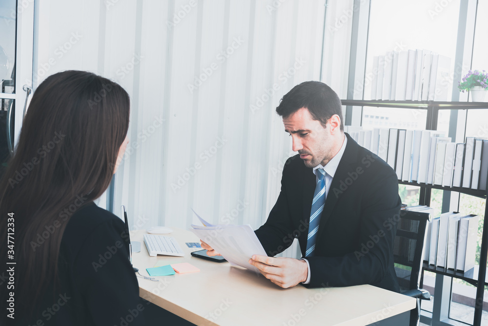 Boss interviews a female applicant in the office. Boss interviews a female applicant in the office.