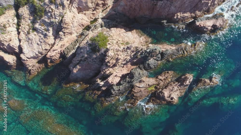 AERIAL DRONE TOP DOWN ZENITHAL SMOOTH SIDE SHOT OF MEDITERRANEAN ROCKY SEA SIDE WITH STUNNING CLEAR BLUE TURQUOISE WATER AERIAL DRONE TOP DOWN ZENITHAL SMOOTH SIDE SHOT OF MEDITERRANEAN ROCKY SEA SIDE WITH STUNNING CLEAR BLUE TURQUOISE WATER