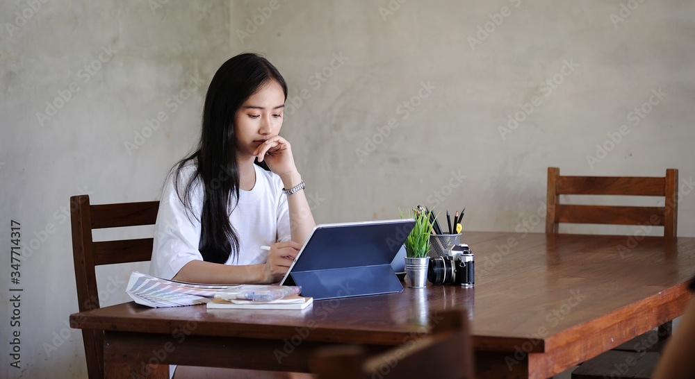 Business women work from home living room enjoying sunny morning on the day with documents and laptop people Consulting and business planning. Business women work from home living room enjoying sunny morning on the day with documents and laptop people Consulting and business planning.