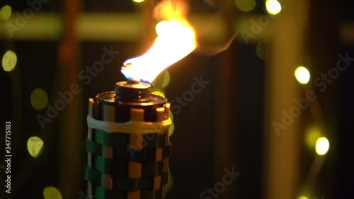 Cinematic shot of Bamboo oil lamp or pelita for eid or hari raya decoration 