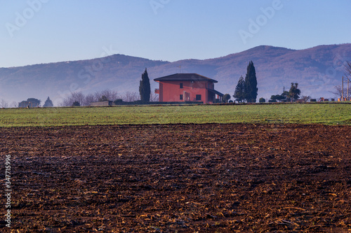 house in plowed field i Piedimonte matese photo