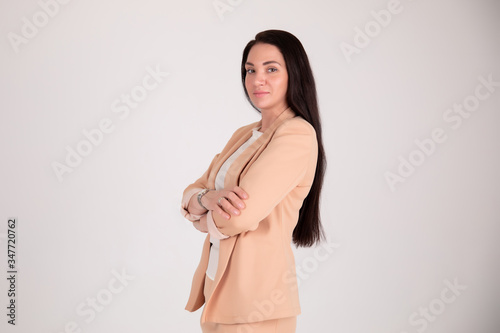 business woman on grey background with copy space. Director in suit