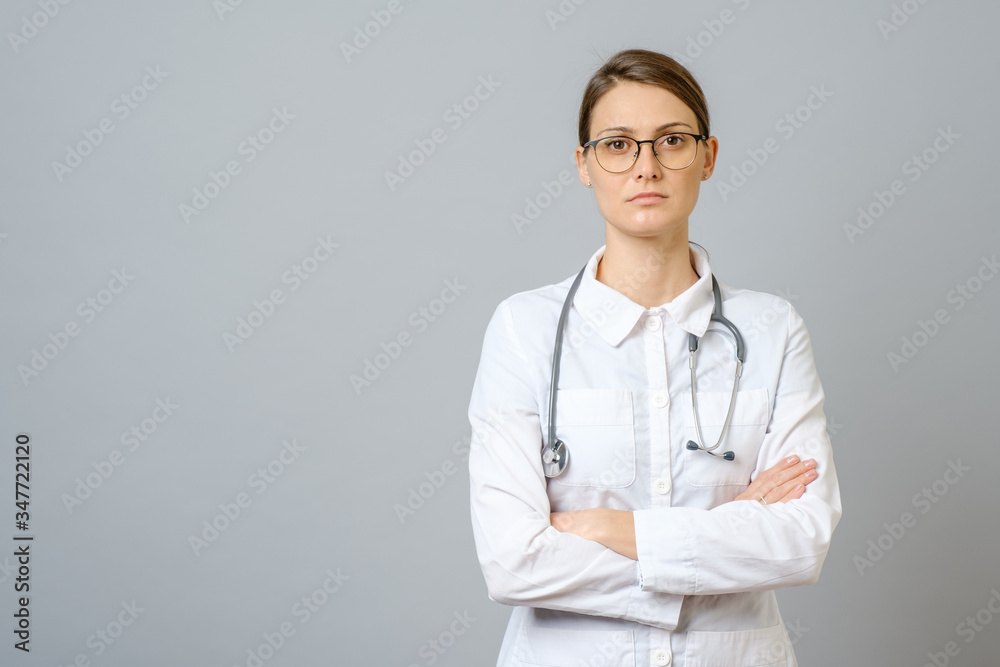 Portrait of serious doctor with stethoscope looking at camera Portrait of serious doctor with stethoscope looking at camera