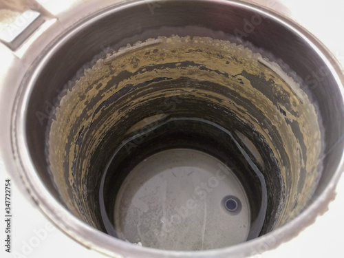 Scale in electric kettle There is a little water in the kettle.
