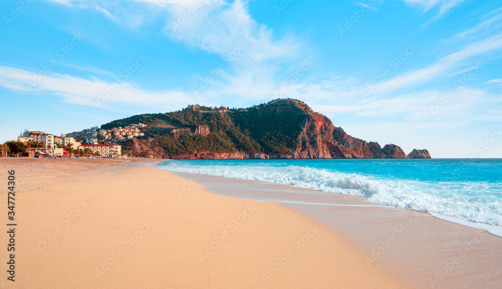 Fototapeta premium Beach of Cleopatra with sea and rocks of Alanya peninsula - Antalya, Turkey