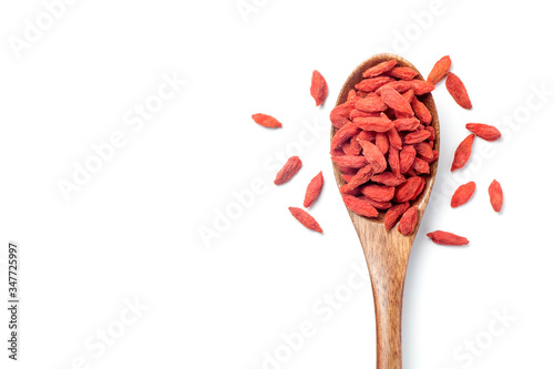 Canvastavla Dried goji berries (Chinese wolfberry) in a wooden spoon, Isolated on white background