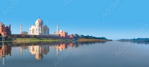 Taj Mahal mausoleum reflected in Yamuna river - Agra, Uttar Pradesh, India photo