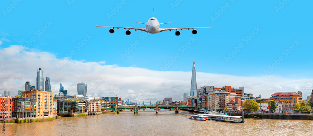 Skyline of London with the Thames River with airplane - United Kingdom