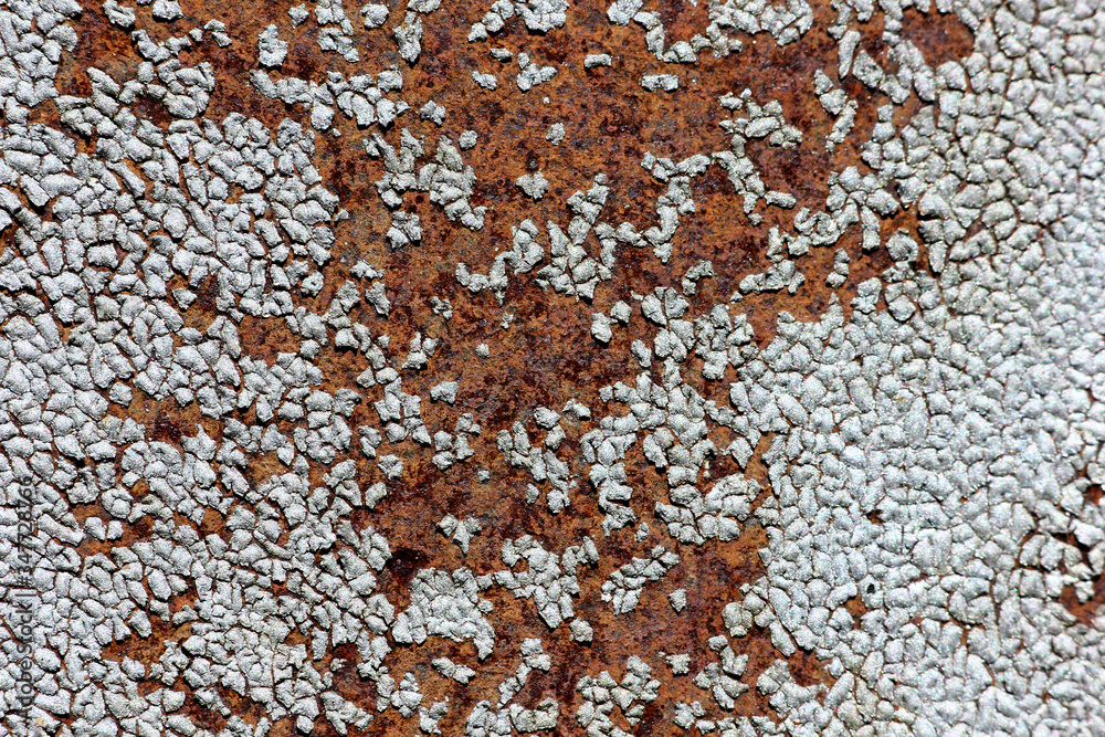 textured background with cracked paint on a rusty surface textured background with cracked paint on a rusty surface