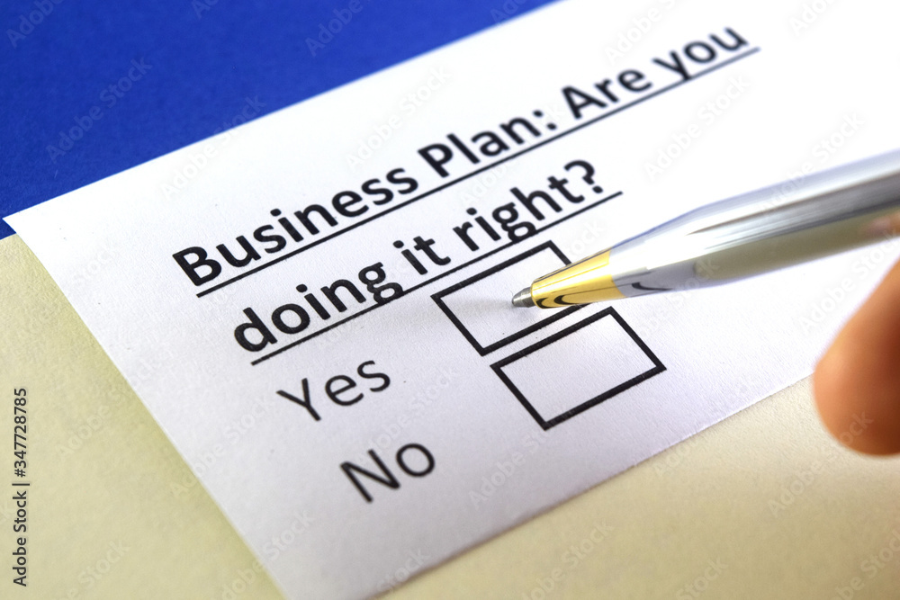 One person is answering question about business plan. One person is answering question about business plan.
