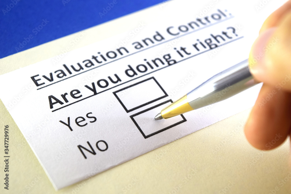 One person is answering question about evaluation and control. One person is answering question about evaluation and control.