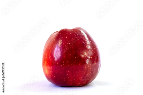 Red Apple on a white background. Organic fruit. Healthy lifestyle. Sweet fruit. Natural vegetarian healthy food. White background.