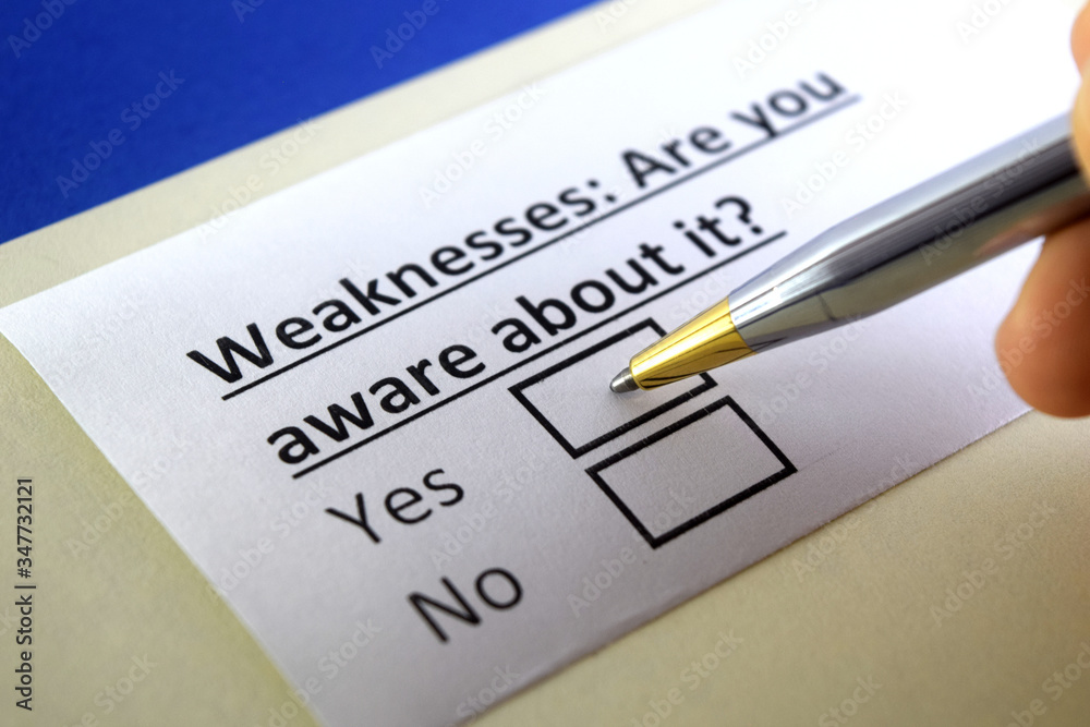 One person is answering question about weaknessess. One person is answering question about weaknessess.