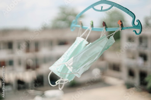 Hang dry disposable medical mask in the air © suchalinee