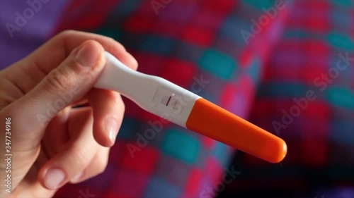 Positive pregnancy test in female hands