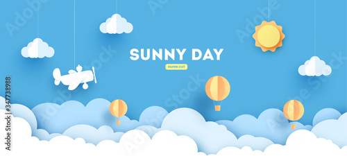 Cloudscape , blue sky with clouds and sun , paper art style. concept. paper cut design with balloons and airplane.