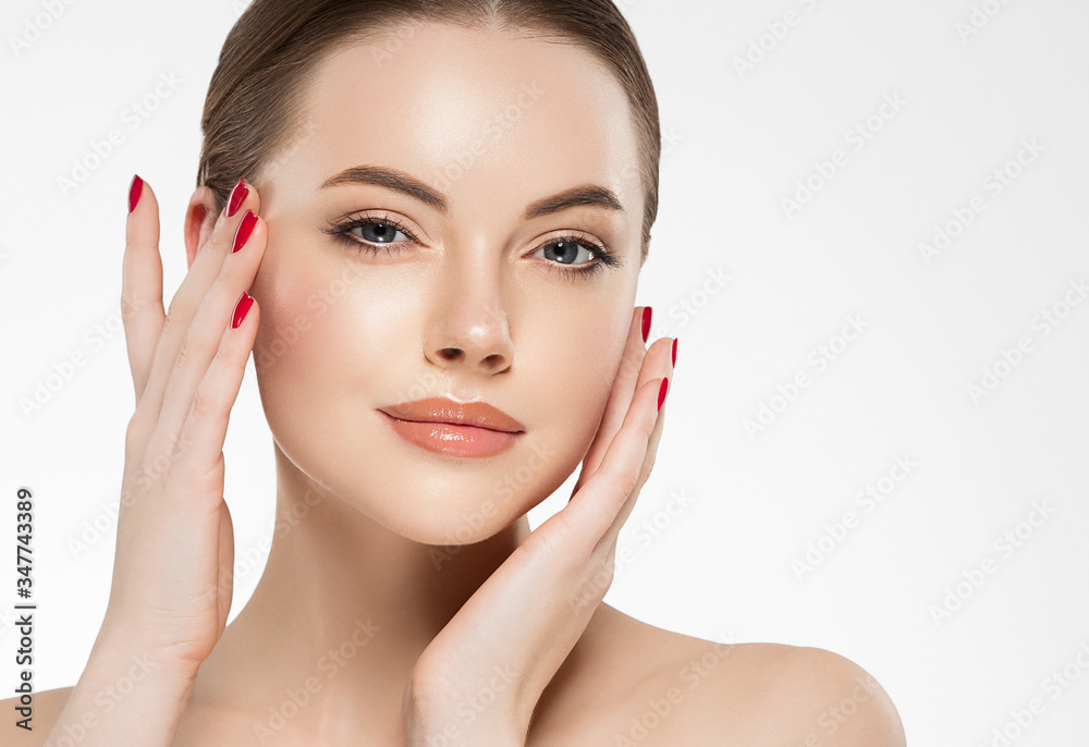 Woman beauty healthy clean skin manicure nails hand touching face spa beautiful female concept Woman beauty healthy clean skin manicure nails hand touching face spa beautiful female concept