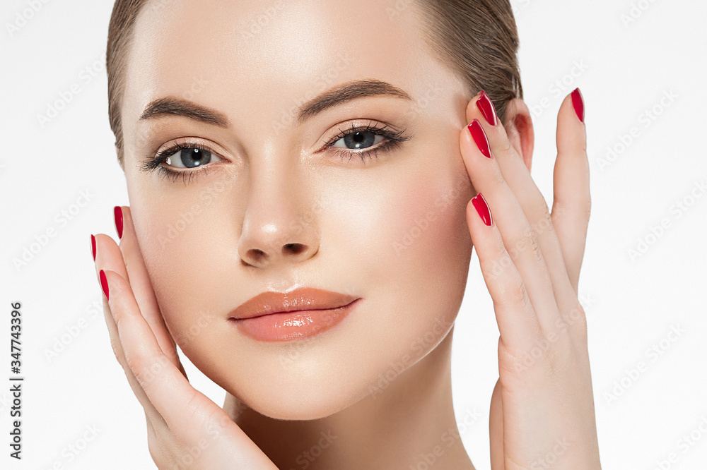 Woman beauty healthy clean skin manicure nails hand touching face spa beautiful female concept Woman beauty healthy clean skin manicure nails hand touching face spa beautiful female concept