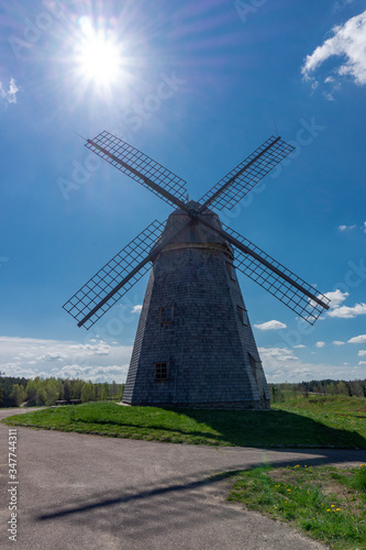 Historic windmill in a lush green field