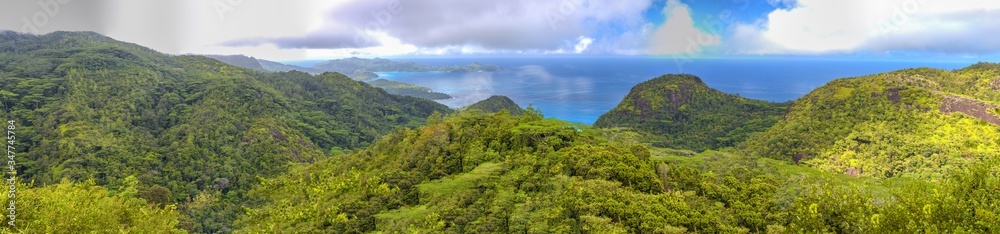 Fototapeta premium Panoramic aerial view of Mountains, Seascape and Vegetation at sunset