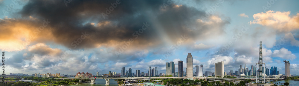 Panoramic aerial view of Singapore skyline from a drone point of view at dusk