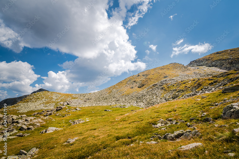 Beautiful mountain scenery in a sunny summer day. Rila mountain, Bulgaria. Hiking/ trekking concept. Beautiful mountain scenery in a sunny summer day. Rila mountain, Bulgaria. Hiking/ trekking concept.