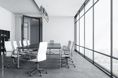 Bright conference room interior with city view.