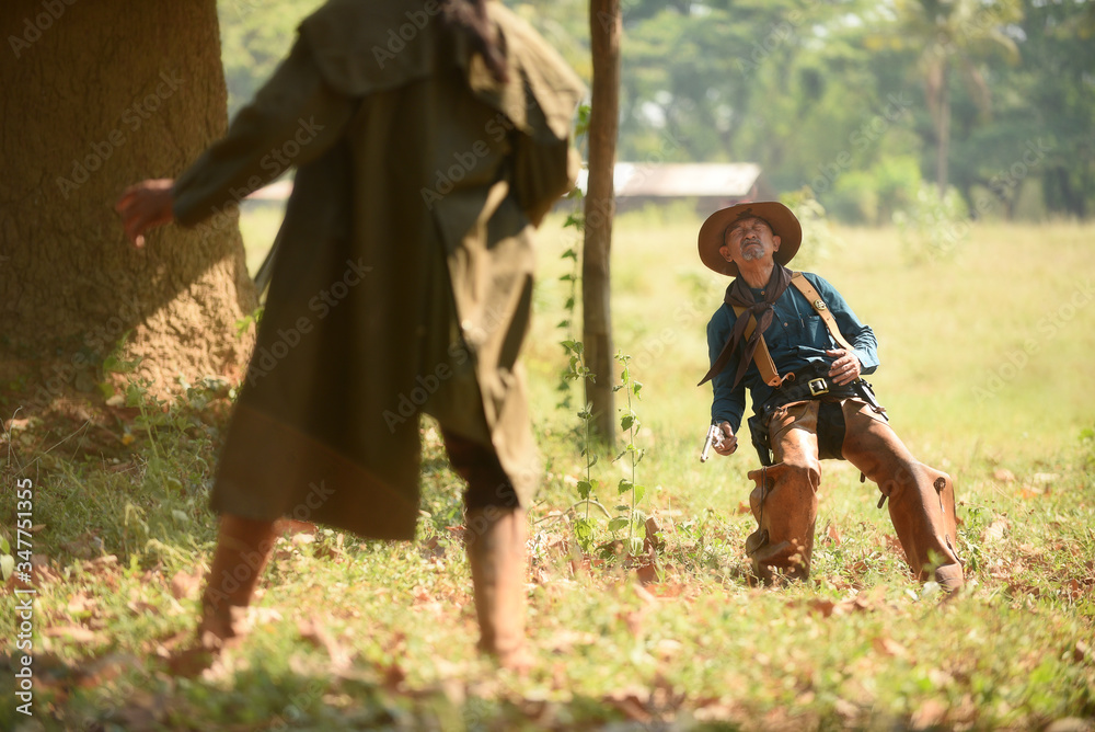 Cowboy with gun prepares to gunfight Cowboy with gun prepares to gunfight