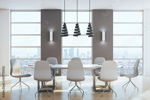 Modern meeting room with panoramic city view.