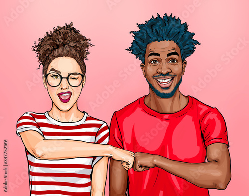 Friends give fist bump, agree to work together, have happy facial expressions rejoice success and cooperation, have toothy smiles, isolated over purple background. Team work concept
