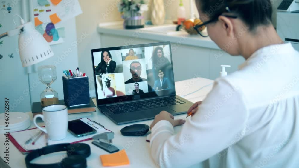 A woman in quarantine is taking part in an online conference A woman in quarantine is taking part in an online conference