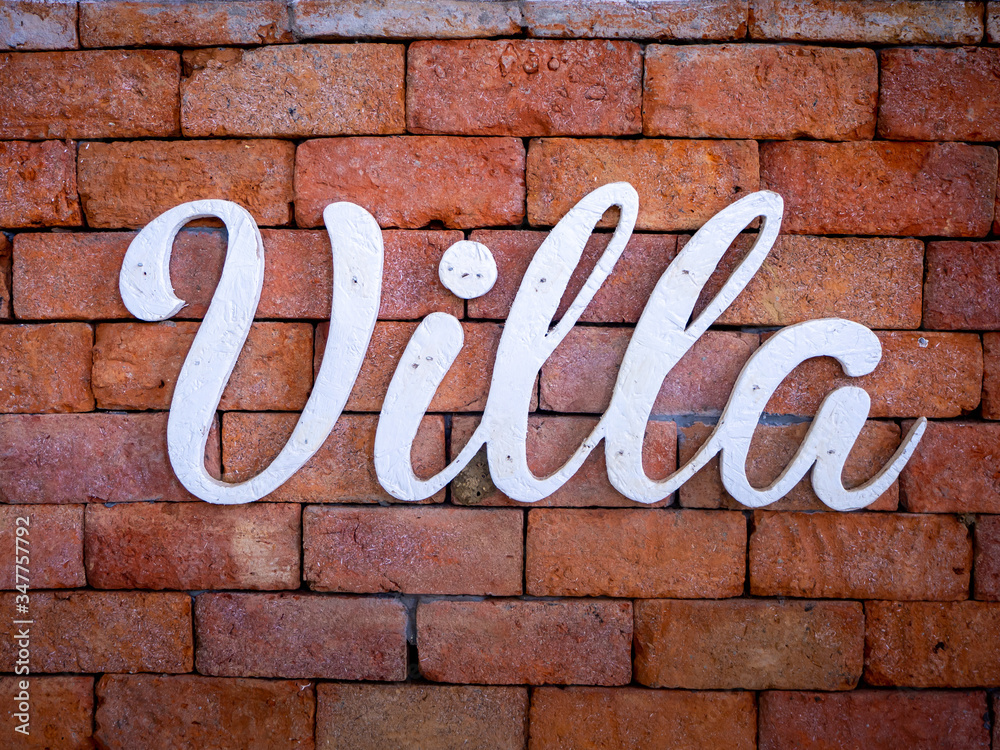 Villa on old red brick wall texture background Villa on old red brick wall texture background
