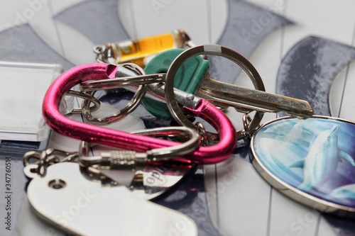 Close up of keys and accessories on colourful carabiner