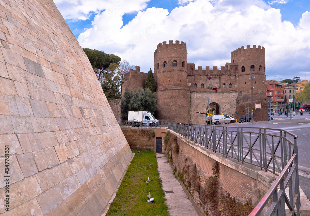 The Pyramid of Cestius and Porta San Paolo in eternal city of Rome view