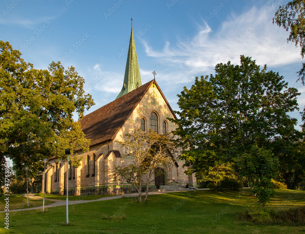 Stone church in Gustavsberg on a summer day against a blue sky Stone church in Gustavsberg on a summer day against a blue sky
