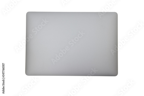 Close-up top view of ultrabook, a thin and light laptop, in space grey color on white isolated background