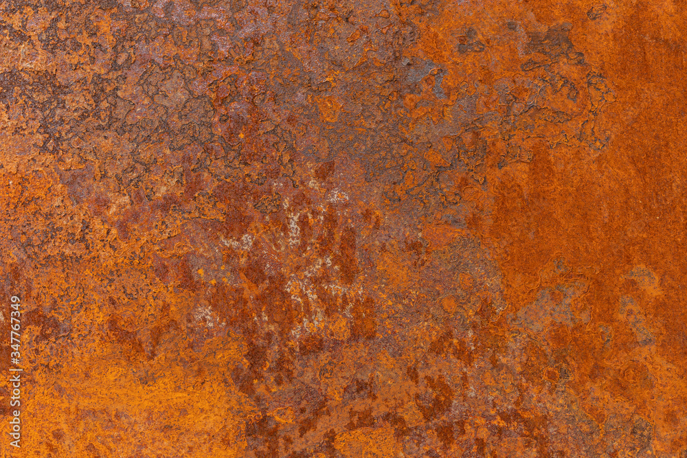 Orange textured old rusty metal surface. An weathered oxidized patina with a copper color, texture and structure. Vintage material effect Orange textured old rusty metal surface. An weathered oxidized patina with a copper color, texture and structure. Vintage material effect