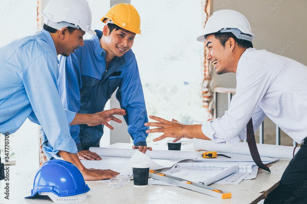 Engineer team and worker with helmet looking paper plans at construction site. Engineer team and worker with helmet looking paper plans at construction site.